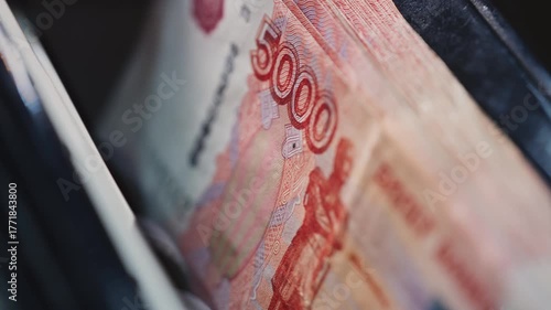 5000 Russian rubles in electronic money counting machine, accounting. Financial transaction in the bank. RUB Mortgage, Seller or broker considers finances. Economic crisis in Russia. Slow motion