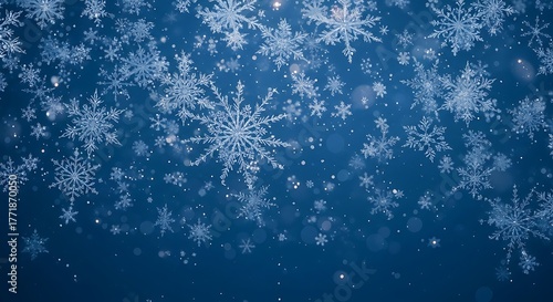Falling snowflakes on a blue background create a winter wonderland scene