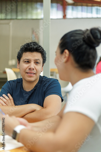 Hispanic Couple Working and Conversing in a Bakery