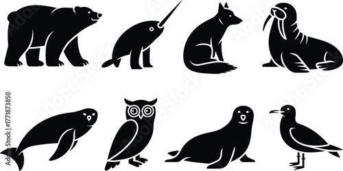 Set of Arctic animal silhouettes including bear, seal, fox, owl, walrus, bird, and narwhal, black vector illustration for wildlife, nature, and environment design