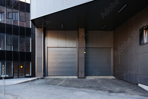 An automatic gates at the entrance to an under underground parking on residential building in the city.