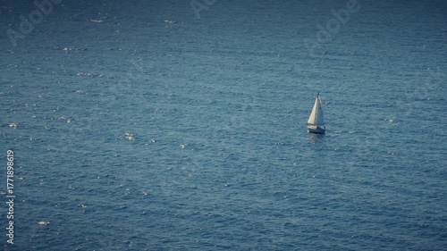 sailboat in the sea swaying in the wind