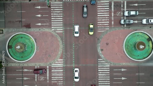 Cinematic top-down video showing movement of cars and urban infrastructure at major intersection in Guadalajara