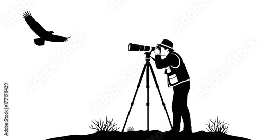 Silhouette of a wildlife photographer with a camera and flying bird