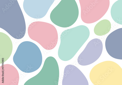 Abstract background with irregular pastel colored organic shapes on a white surface.