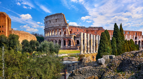 Rome, Italy. Roman Colosseum (Coliseum or Colosseo) Ancient Ruins of Flavian Amphitheatre. Arena for Gladiator Fightings. World Famous Landmark and Very Popular Touristic Destination Vacation Trip.