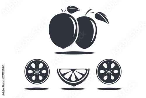 Two monochrome plums with leaves sit above assorted lemon wedges in stark composition