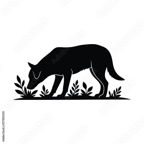 A black silhouette of a dog sniffing the ground near some plants, the dog is focused on something on the ground