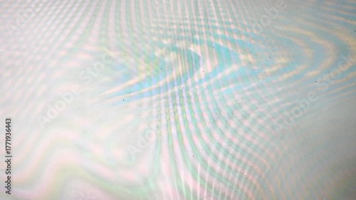 colorful interference pattern with wavy lines and soft rainbow hues. The image features moiré-like optical effects and a subtle gradient texture, creating a futuristic and digital aesthetic.