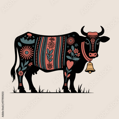 Decorative cow with bell and floral patterns standing on grass  