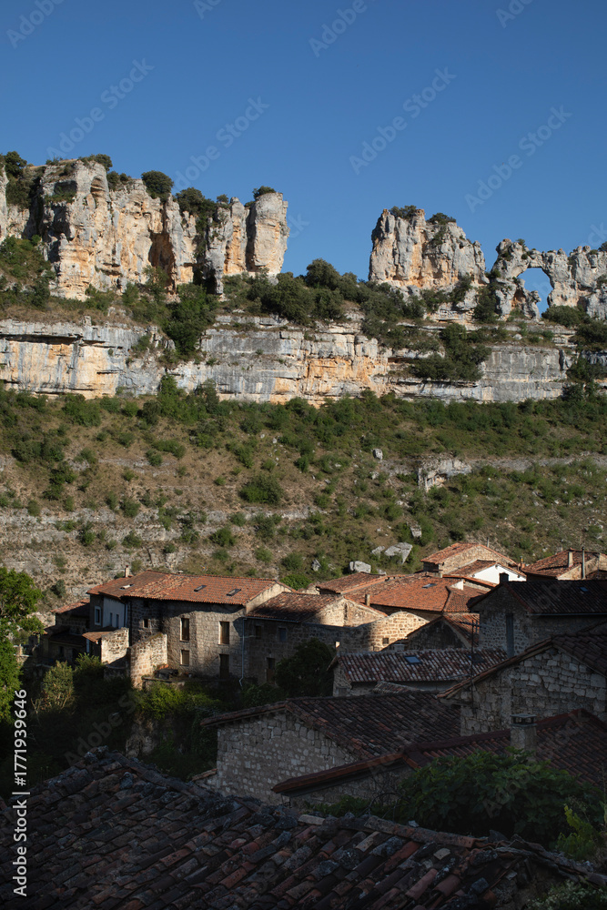 Fototapeta premium Panoramic view of the picturesque town of Orbaneja del Castillo, located in the Sedano Valley, Burgos. Here you'll find a natural rock formation known as The Kiss of the Camels The Map of Africa.