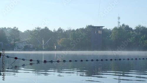 Early morning mist floating over a calm lake