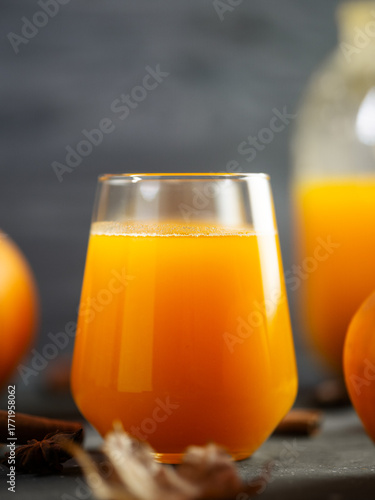close-up of pumpkin juice in a glass. A healthy, natural autumn drink.