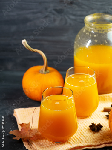 Glasses of pumpkin juice. Homemade drink prepared in a jar.