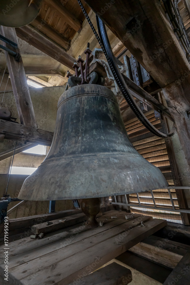 Obraz premium Blois, France - 10 27 2025: Detail view of one of the 48 bells in the bell tower of the Basilica of Our Lady of the Trinity
