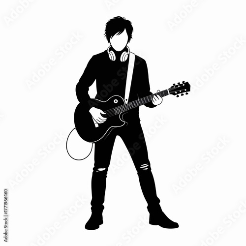 Silhouette of a young man playing an electric guitar with headphones