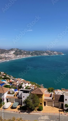 A slightly stormy Mediterranean Sea in La Herradura, Andalusia, Spain, with rolling waves and dramatic coastal light.
