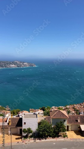 A slightly stormy Mediterranean Sea in La Herradura, Andalusia, Spain, with rolling waves and dramatic coastal light.