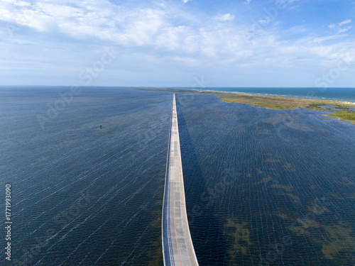 Wallpaper Mural An aerial view shows Rodanthe Bridge commonly called the Jug Handle Bridge crossing a wide ocean, carries North Carolina Highway 12 from Rodanthe to the southern point of Pea Island Torontodigital.ca