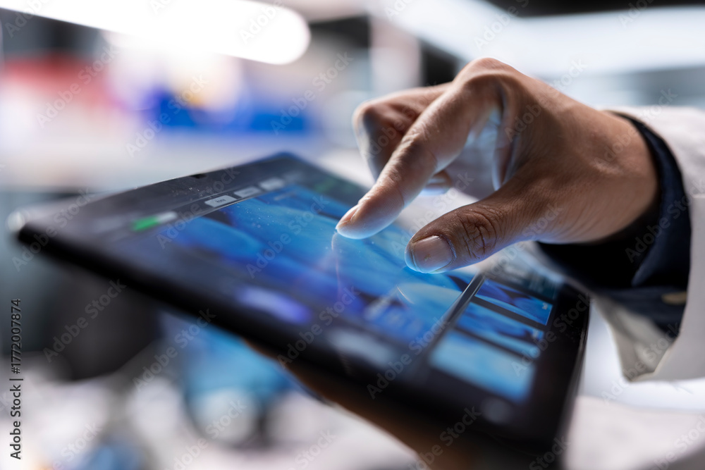Obraz premium Close up of tablet used by male scientist for molecular biology samples, working in chemistry lab. Experiment showcases innovation in genetics research and nanotechnology, healthcare solutions.