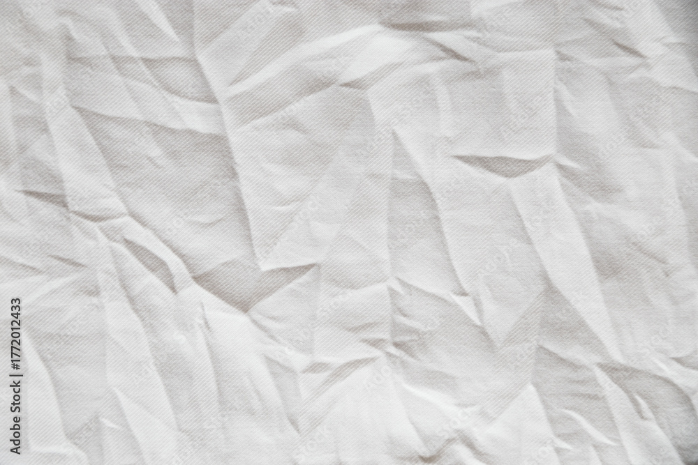 Obraz premium A close up view of a wrinkled white fabric creating an abstract design