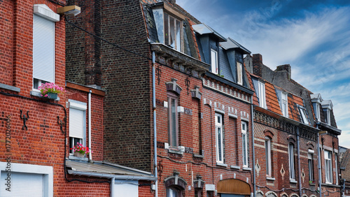 Row of traditional Flemish brick houses with stepped gables