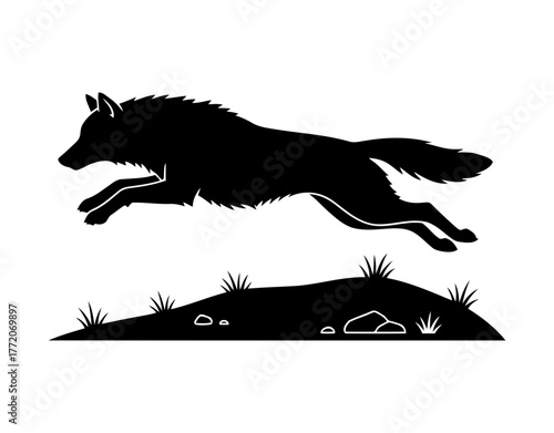 Vector art of silhouette of a wolf jumping over a hill
