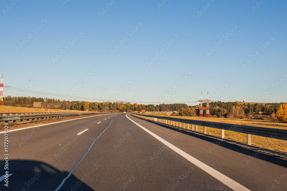 Fototapeta premium Empty highway road on sunny autumn day