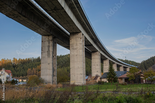 Modern concrete highway bridge over rural landscape
