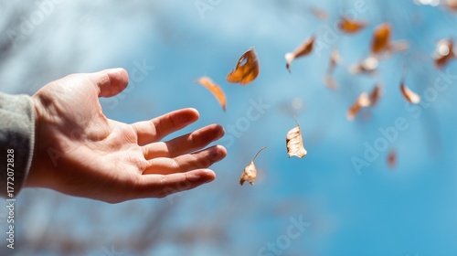 Hand letting go of the past year, symbolic gesture of release and new beginnings