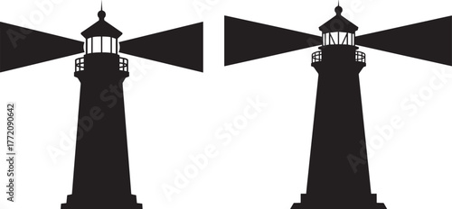 Two tall lighthouse beams shining silhouette