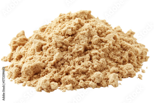 Pile of light-brown, textured powder on a dark backdrop