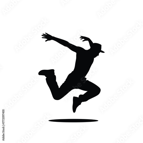 Dynamic dancer in mid air with hat silhouette jumping