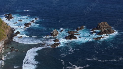 Scenic waves at Mawun Beach, Lombok Island, Indonesia — tropical bay with blue water and gentle surf, popular spot for surfing and relaxation