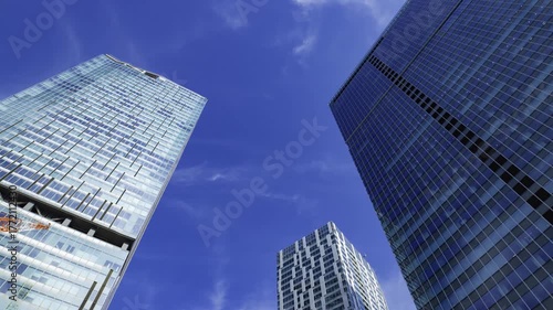 A timelapse of cloud reflecting the urban city building in Tokyo wide shot