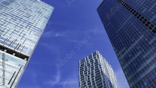 A timelapse of cloud reflecting the urban city building in Tokyo wide shot panning