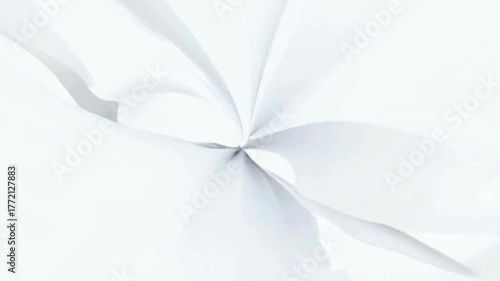Crinkled white paper with a radial fold pattern on a plain background.