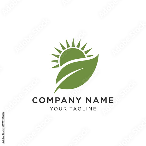 A green leaf with a sun rising behind it, symbolizing growth and nature.