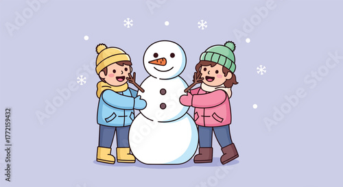 Two happy children building a snowman in the snow.