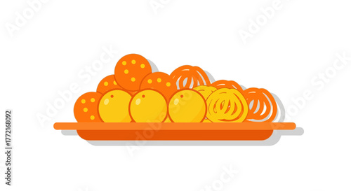 A Vibrant Plate of Indian Sweets Laddoos and Jalebis.