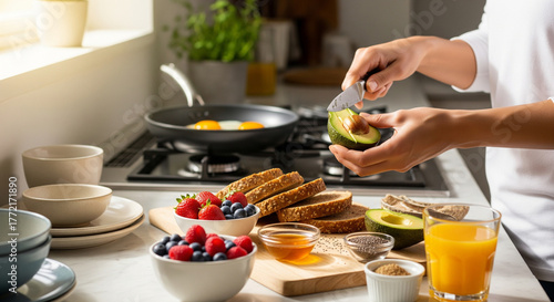 Preparing a delicious and balanced breakfast with fresh avocado toast, eggs, and berries for a healthy lifestyle morning routine