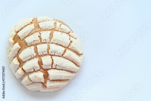 Vanilla concha over white background and copy space.