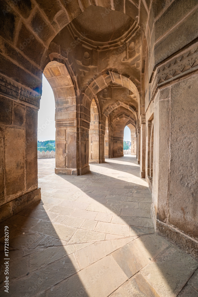 Naklejka premium 16th-century sandstone tomb of Sher Shah Suri in Sasaram, Bihar, set on a lake with a grand dome and intricate Indo-Islamic architecture reflecting history and royal elegance. 