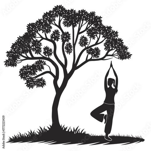 Silhouette of a woman performing the vrksasana or tree pose yoga posture under a large leafy tree in a grassy field against a white background