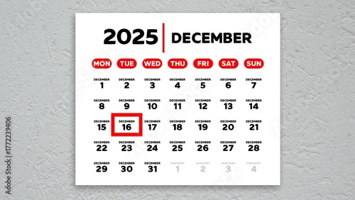 The date December 16th marked with a red cursor on the wall calendar 2025
