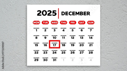 The date December 17th marked with a red cursor on the wall calendar 2025