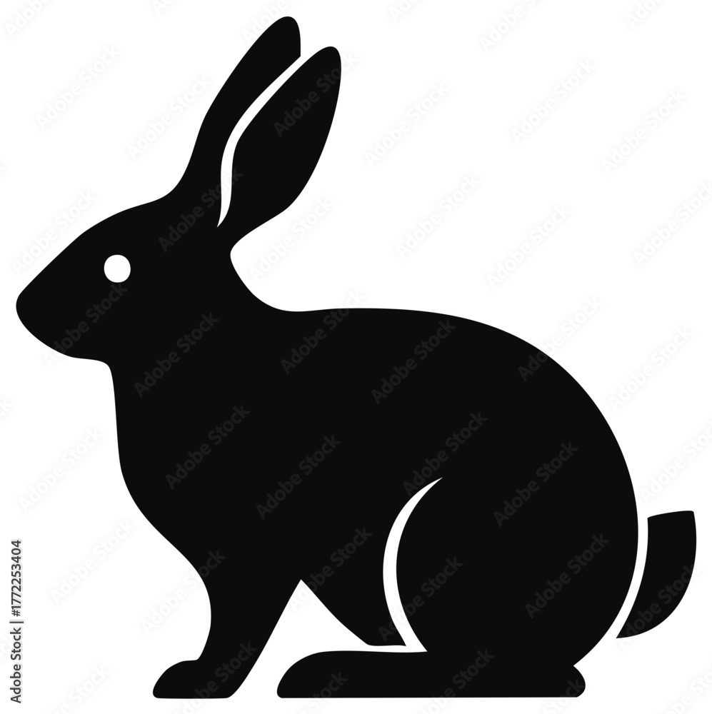 Obraz premium Black silhouette of a rabbit sitting attentively with long ears raised