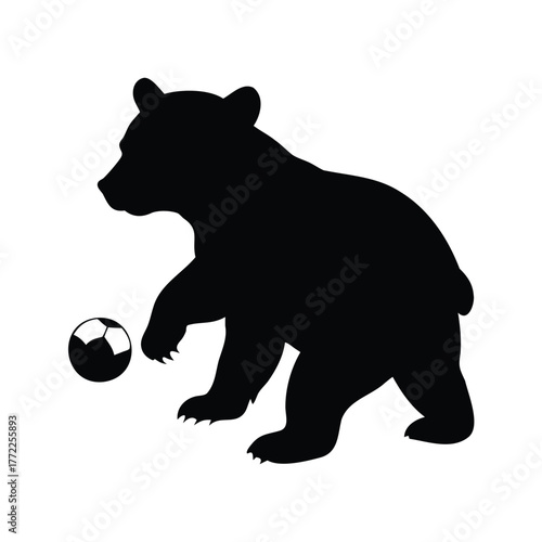 Silhouette of a bear cub about to kick a soccer ball, bear cub playing silhouette vector illustration