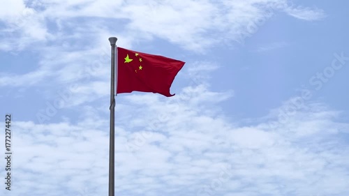 Chinese flag on sky background.