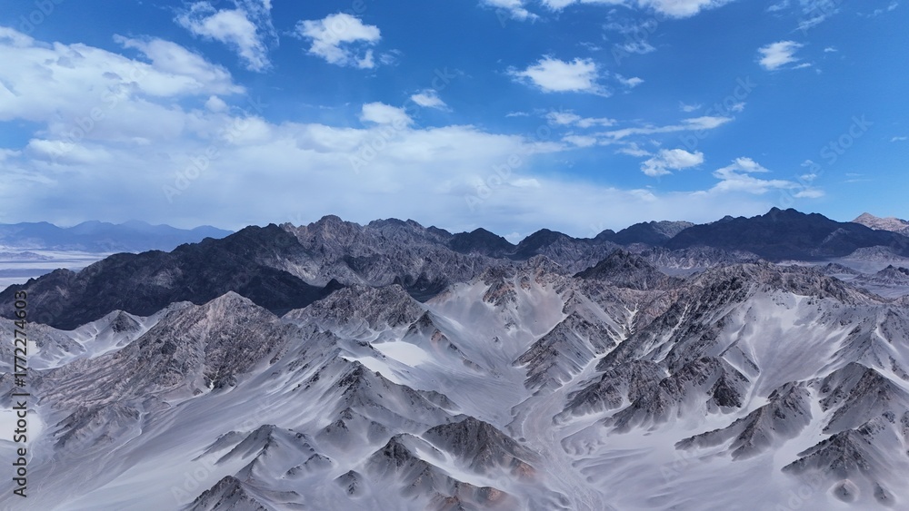 Fototapeta premium Black Mountain desert mountain landscape,Black Mountain peaks under blue sky,Majestic and desolate scenery of Black Mountain,Black Mountain scenery on the western plateau,Black mountains with blue sky